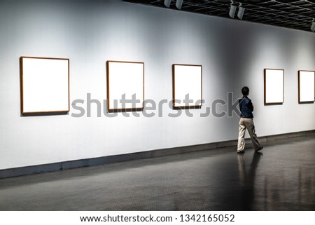 beautiful girl watching frame in the gallery