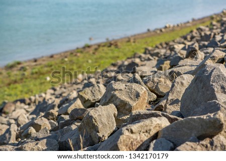 Rocks on the riverbank with sping sunshine
