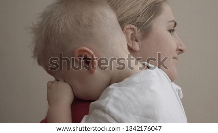 Loving mom (mom) kisses the baby, Regrets the child, Shakes in her arms, Put the baby to sleep in her arms. Concept of: Baby plays, Love, Tears, Sadness, Hugs.