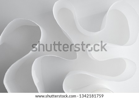 Selective focus on toilet paper placed into abstract form of shape. 