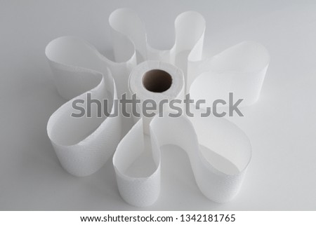 Selective focus on toilet paper placed into abstract form of shape. 