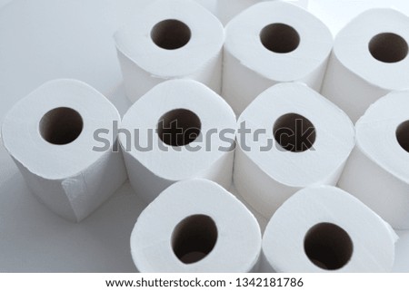 Selective focus on rolls of toilet paper.