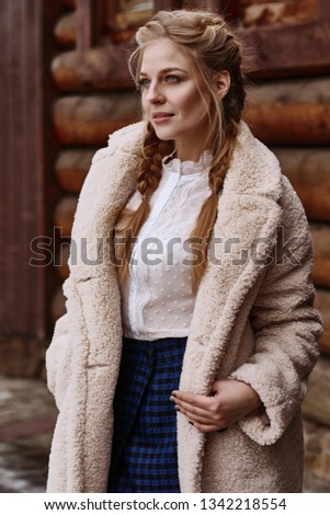 Russian beautiful girl at winter countryside