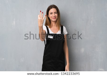 Employee woman happy and counting three with fingers