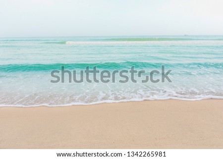 Soft wave of sea on empty sandy beach Background with copy space
