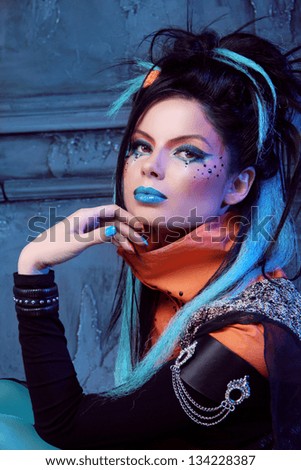 Fashion model posing. Portrait of a punk girl . Art photo