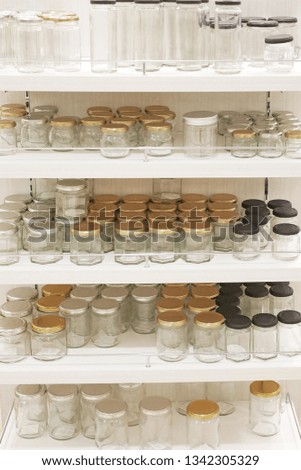 Glass bottles lined with shelves