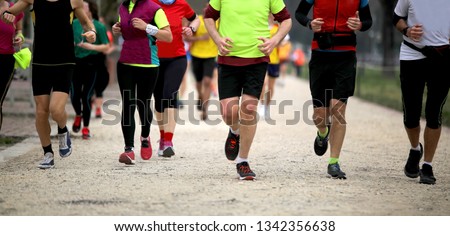 many runners at finish line after the footrace Royalty-Free Stock Photo #1342356638