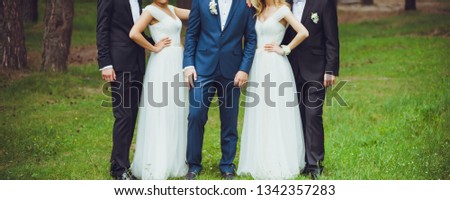 groom and bridesmaid with friends