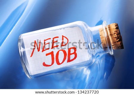 Creative concept of a vintage bottle with a message "Need job"