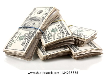 Stacks of one hundred dollars banknotes close-up isolated on white Royalty-Free Stock Photo #134238566