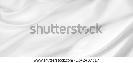 Closeup of rippled white silk fabric Royalty-Free Stock Photo #1342437317