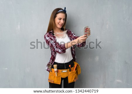 Craftsmen or electrician woman making a selfie
