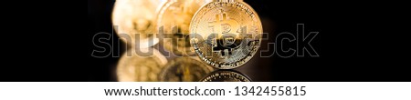 Golden Bitcoin on black backround. New virtual money. crypto currency. Panorama, banner
