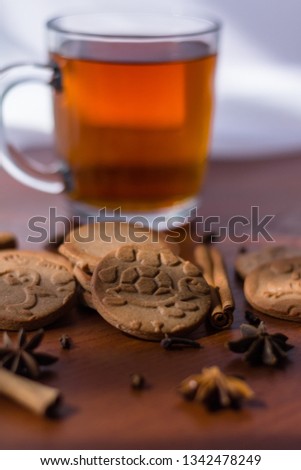 Gingerbread on the table with the ingredients and cup of tea