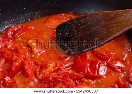 tomato frying on pan, cooking vegetable boiled sauce,  background.