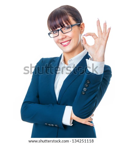 Smiling businesswoman showing sign excellent with her fingers over white