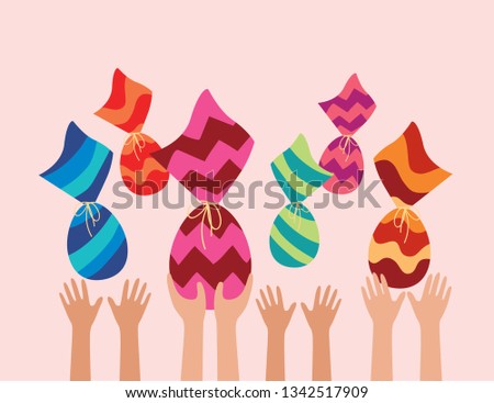 Happy Easter holiday. kids hands catching Easter eggs in air. Chocolate wrapped in colorful pattern. Royalty-Free Stock Photo #1342517909