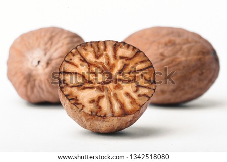 Nutmeg isolated on white background.