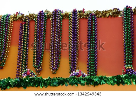 MARDI GRAS BEADS HANGING ON A FLOAT BEFORE A PARADE