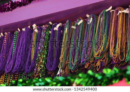 MARDI GRAS BEADS HANGING ON A FLOAT BEFORE A PARADE