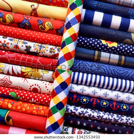 Quilt Fabric Squares Fat Quarters Textiles Warm Cool Palette Rolls                   Royalty-Free Stock Photo #1342553450