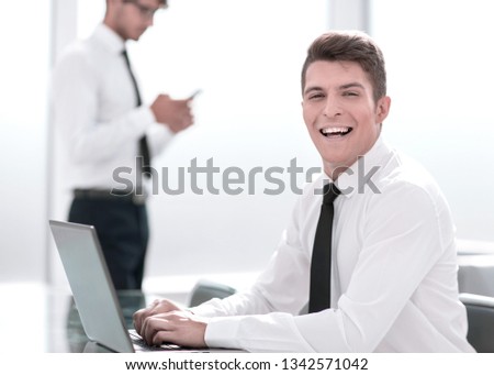 young employee working on a laptop in the office