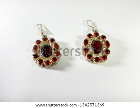 Image red women's earrings. Beautiful jewelry for the gift of a woman
