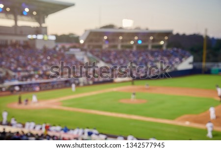 Baseball game blurred background on modern stadium Royalty-Free Stock Photo #1342577945