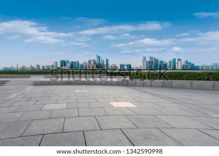 Urban skyscrapers with empty square floor tiles