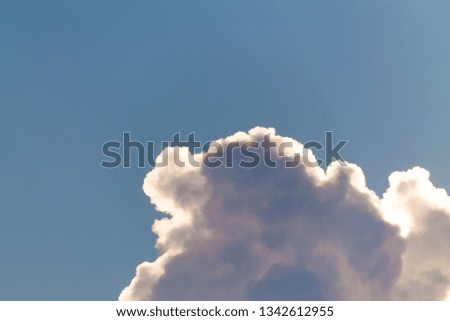 Sunlight through the clouds in the evening sky, Blue sky background with white clouds. Nature cloud blue sky background.