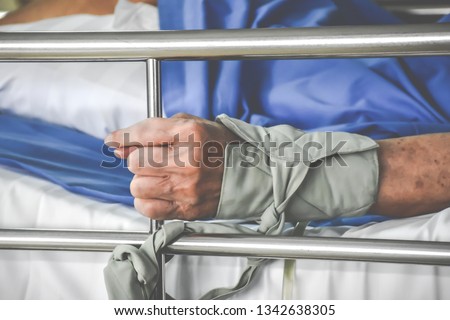 soft focus, Patient restraint on a hospital bed. Royalty-Free Stock Photo #1342638305