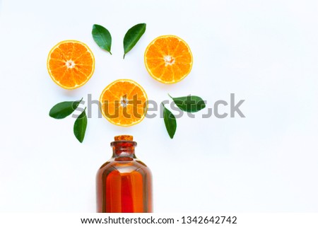 High vitamin C, Orange fruits with essential oil bottle on white background. Copy spae