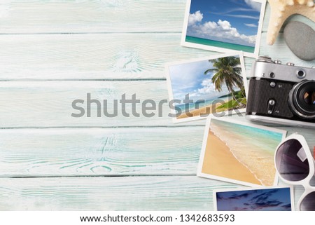 Travel vacation background concept with sunglasses, camera and weekend photos on wooden backdrop. Top view with copy space. Flat lay. All photos taken by me