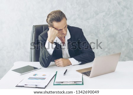 business man is stressed from work , computer laptop on office desk , business concept