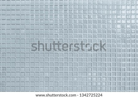 White or gray ceramic wall and floor tiles abstract background. Design geometric mosaic texture for the decoration of the bedroom. Simple seamless pattern backdrop advertising banner poster or web. 