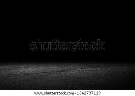 Asphalt surface, racetrack on a black background