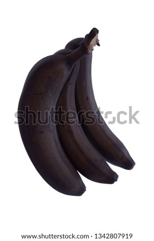 three black overripe bananas isolated on white. Soft focus