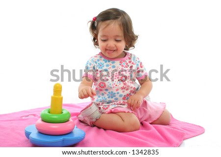 Little girl playing and having fun with generic toy. More pictures of this baby at my gallery