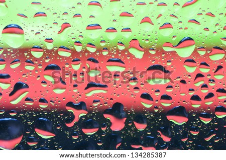 Reflection of abstract colors on the water droplet