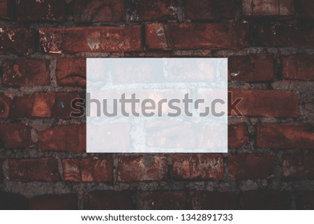 Texture mock up( mock-up, mockup) matte background. A white rectangle for your lettering. Painted brick wall. Graffiti on the wall.