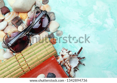 summer card with pebbles, shells and glasses