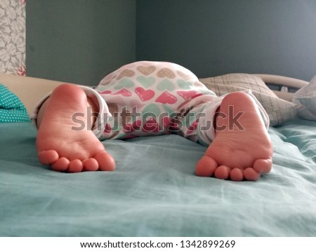 toddler funny pretty nice sweet lovely good rosy heels and feet of a sleeping baby rear view closeup