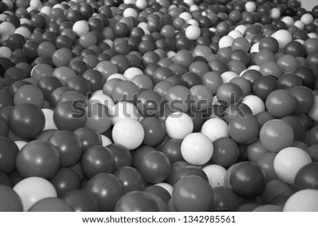 Black grey white balls for dry massage. Black-and-white photo.