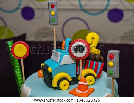 Kids cake decorated with Construction machinery
