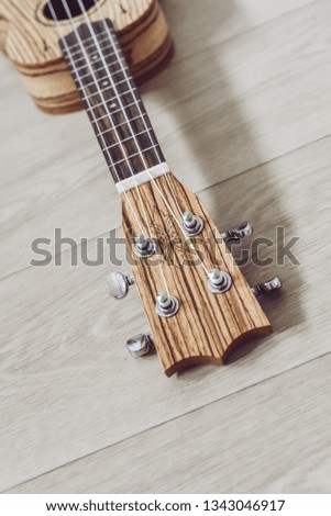 Part of the guitar from textured wood.