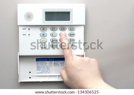 Home security alarm system keypad Royalty-Free Stock Photo #134306525