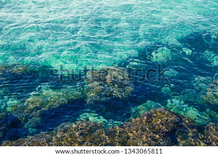 View of abstract background of seascape. Ocean, waves, sky, clouds, islands and rocks. Tropical sea under the beautiful cloudy blue sky leaving for horizon above a surface of the open sea.