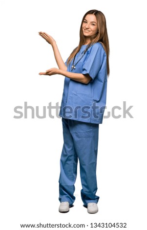 Full body Young nurse extending hands to the side for inviting to come on isolated background