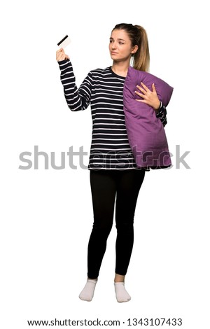 Full body Pretty woman in pajamas taking a credit card without money on isolated background